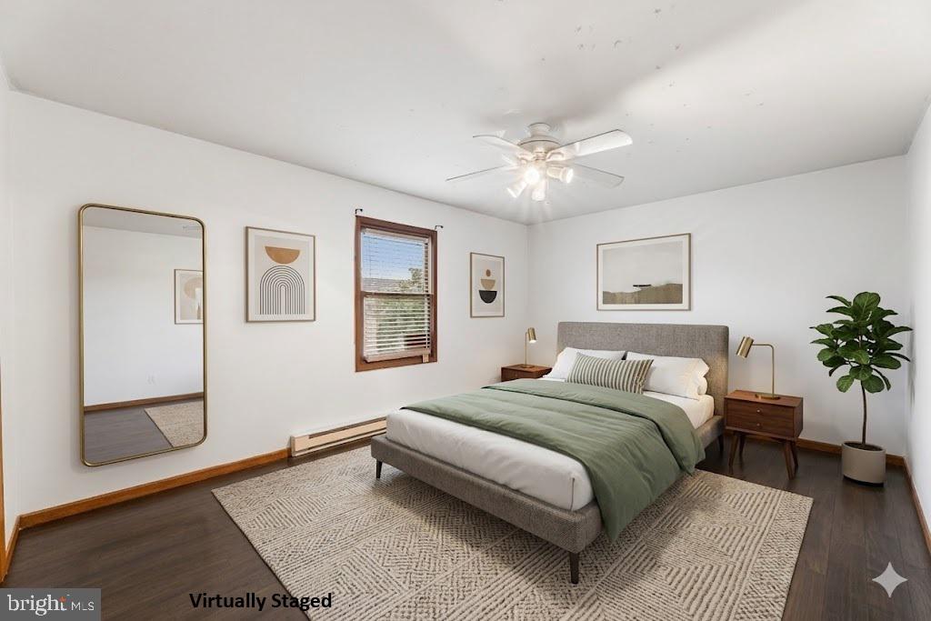 139 Prospect Street Chestertown, MD 21620 - Photo 16 of 28 a bedroom with a large bed and a chandelier