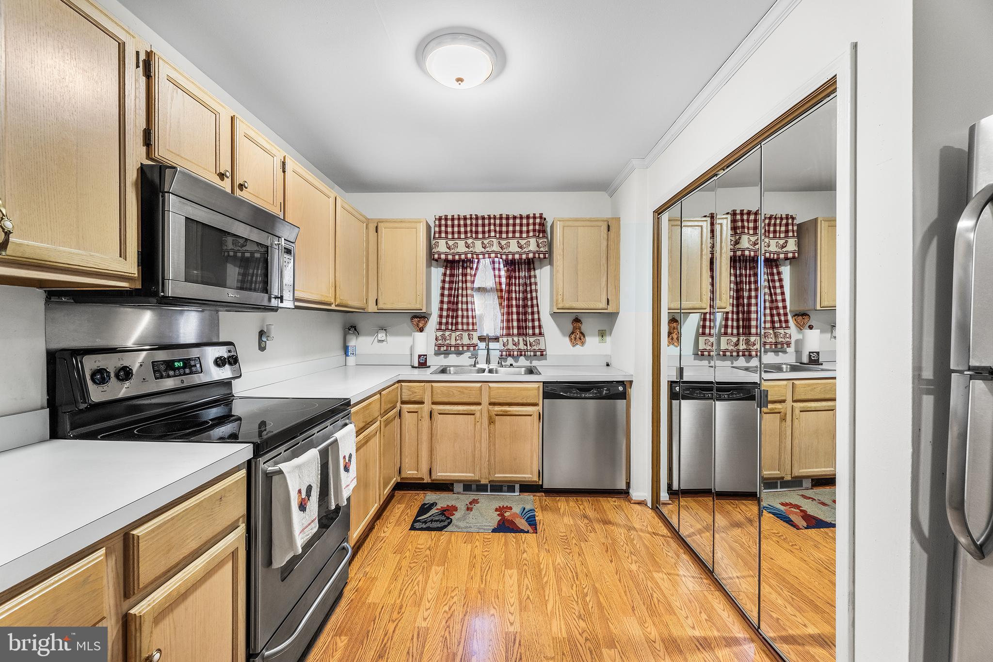 139 Prospect Street Chestertown, MD 21620 - Photo 9 of 28 a kitchen with a sink stove and refrigerator