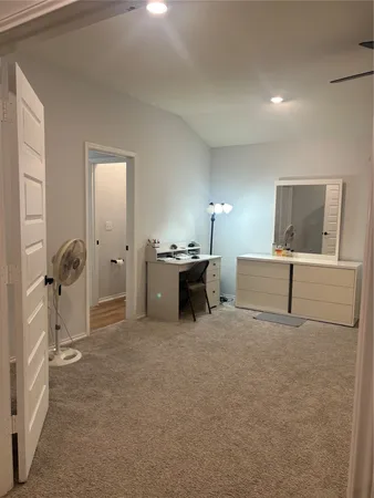 a view of a livingroom with a furniture