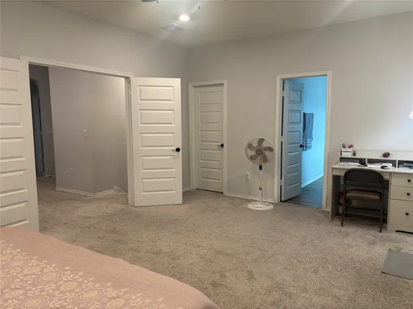 a view of a livingroom with furniture and closet