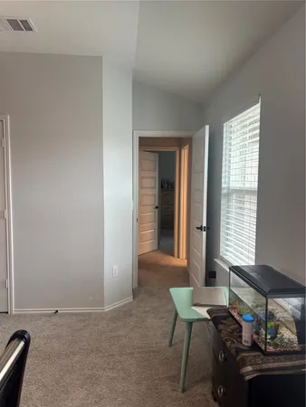 a workspace with furniture and window