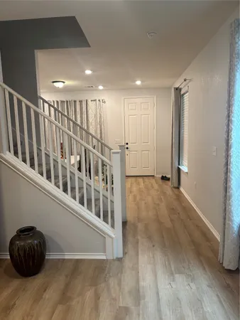 a view of entryway with wooden floor