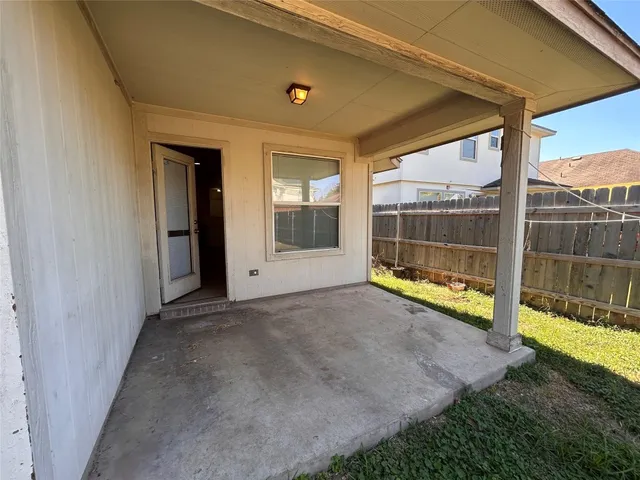 a view of a room with a large window