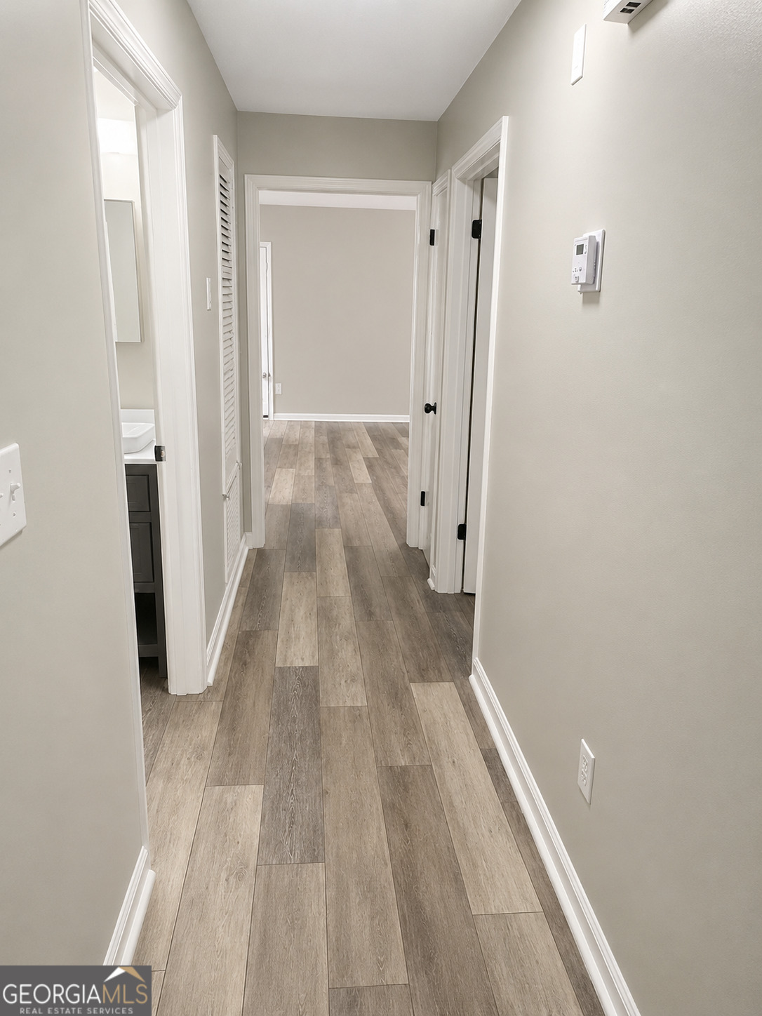 105 Dailey Mill Road McDonough, GA 30253 - Photo 15 of 18 a view of a room with wooden floor and a bathroom
