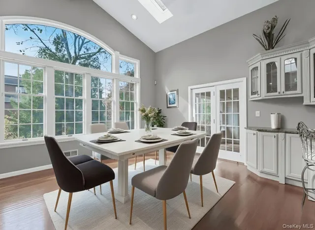 a view of a dining room with furniture window and wooden floor