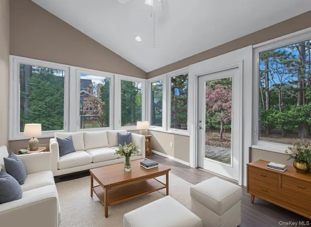 a living room with furniture and windows
