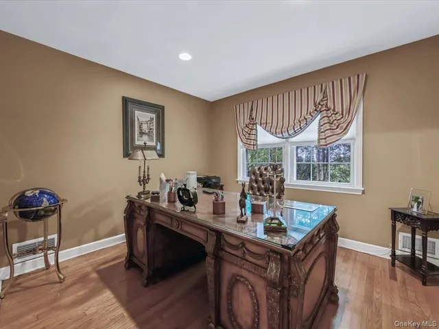 a dining room with a table and chairs