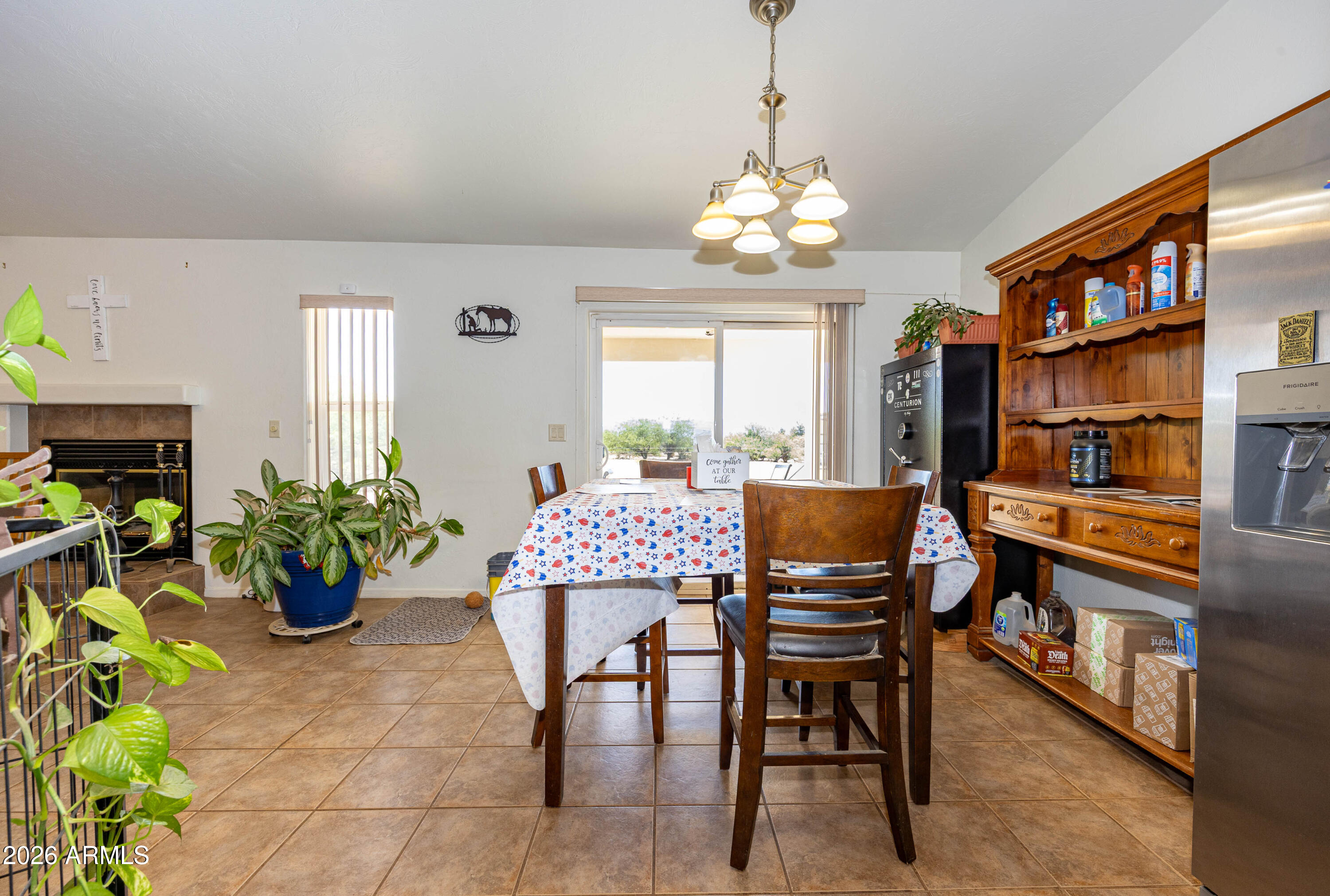 4575 South Kino Road Sierra Vista, AZ 85650 - Photo 15 of 25 a view of a dining room with furniture window and wooden floor