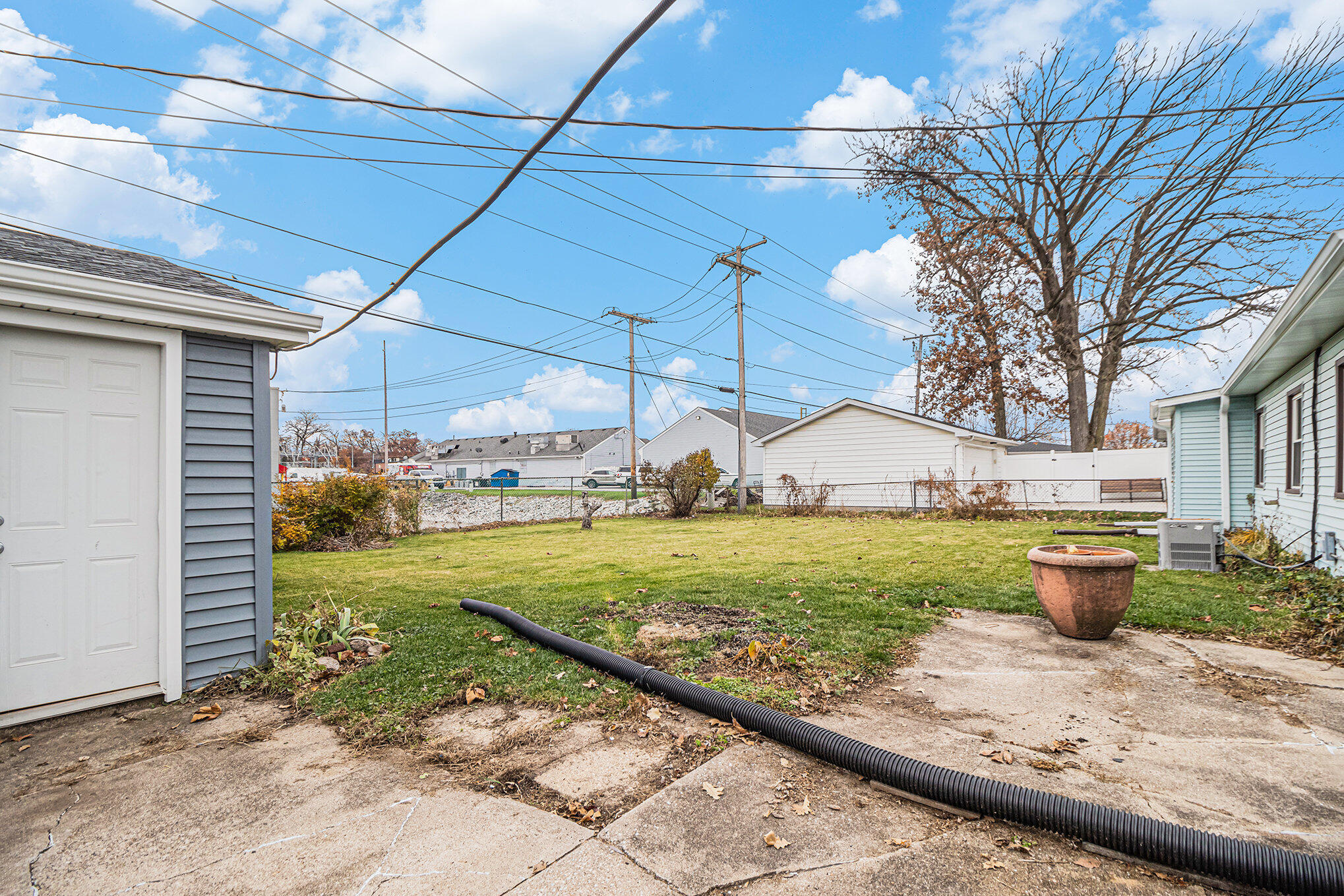 217 Crestview Lane Crown Point, IN 46307 - Photo 14 of 14 a view of a backyard with plants and patio