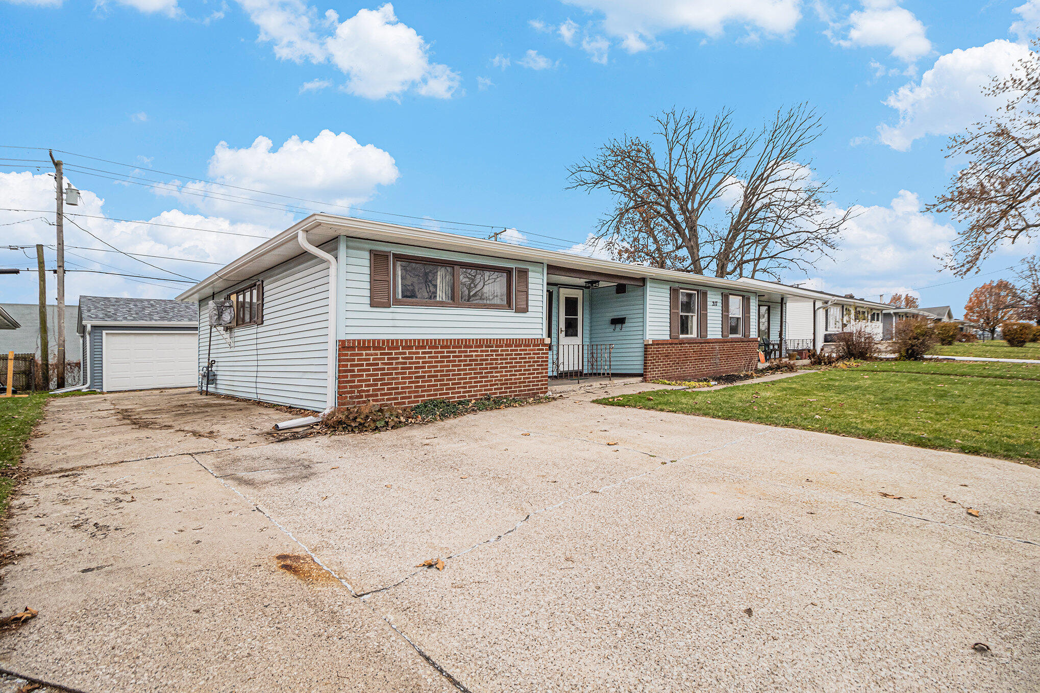 217 Crestview Lane Crown Point, IN 46307 - Photo 2 of 14 a front view of a house with a yard and garage