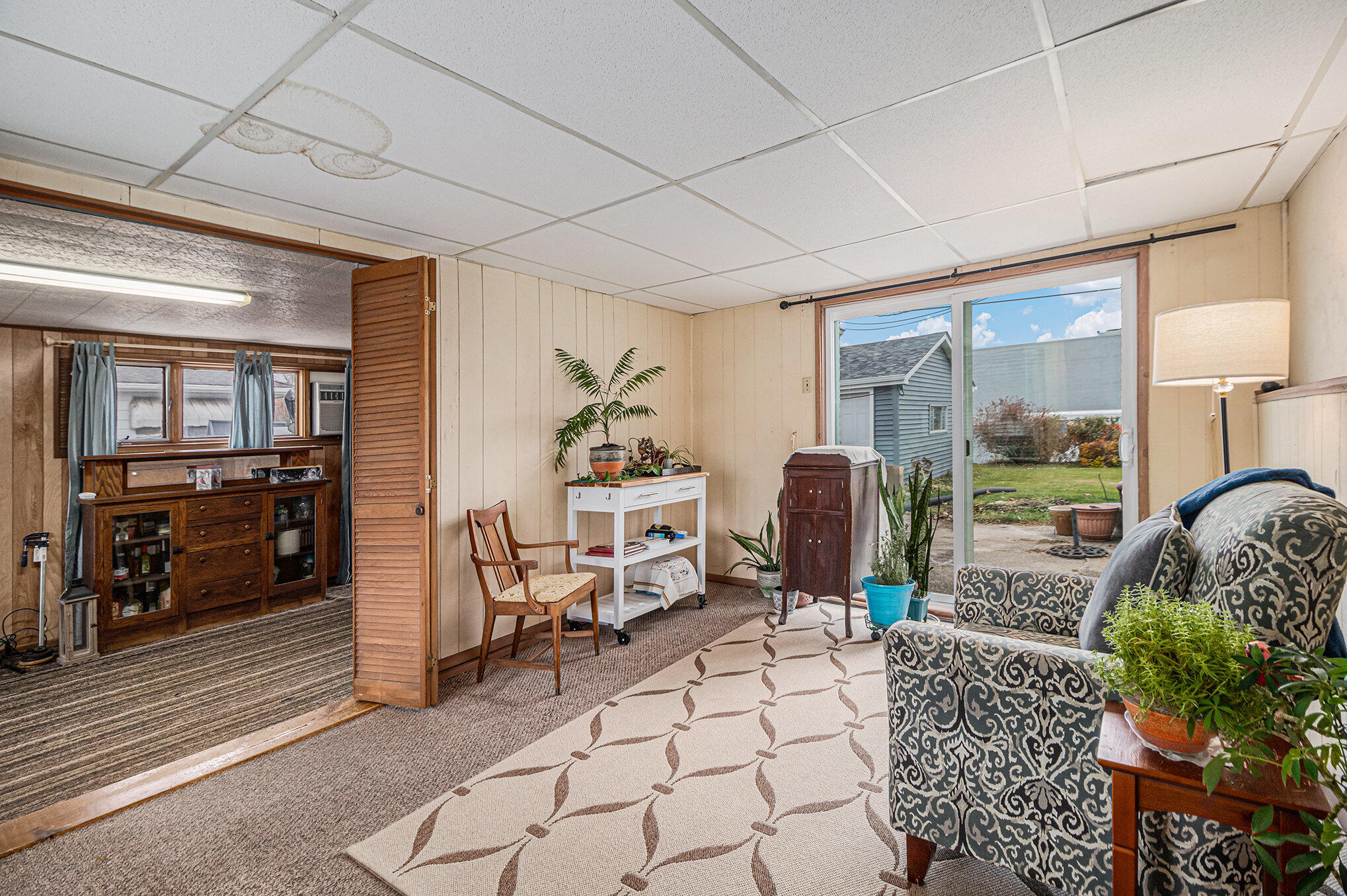 217 Crestview Lane Crown Point, IN 46307 - Photo 8 of 14 a living room with furniture a rug and a floor to ceiling window