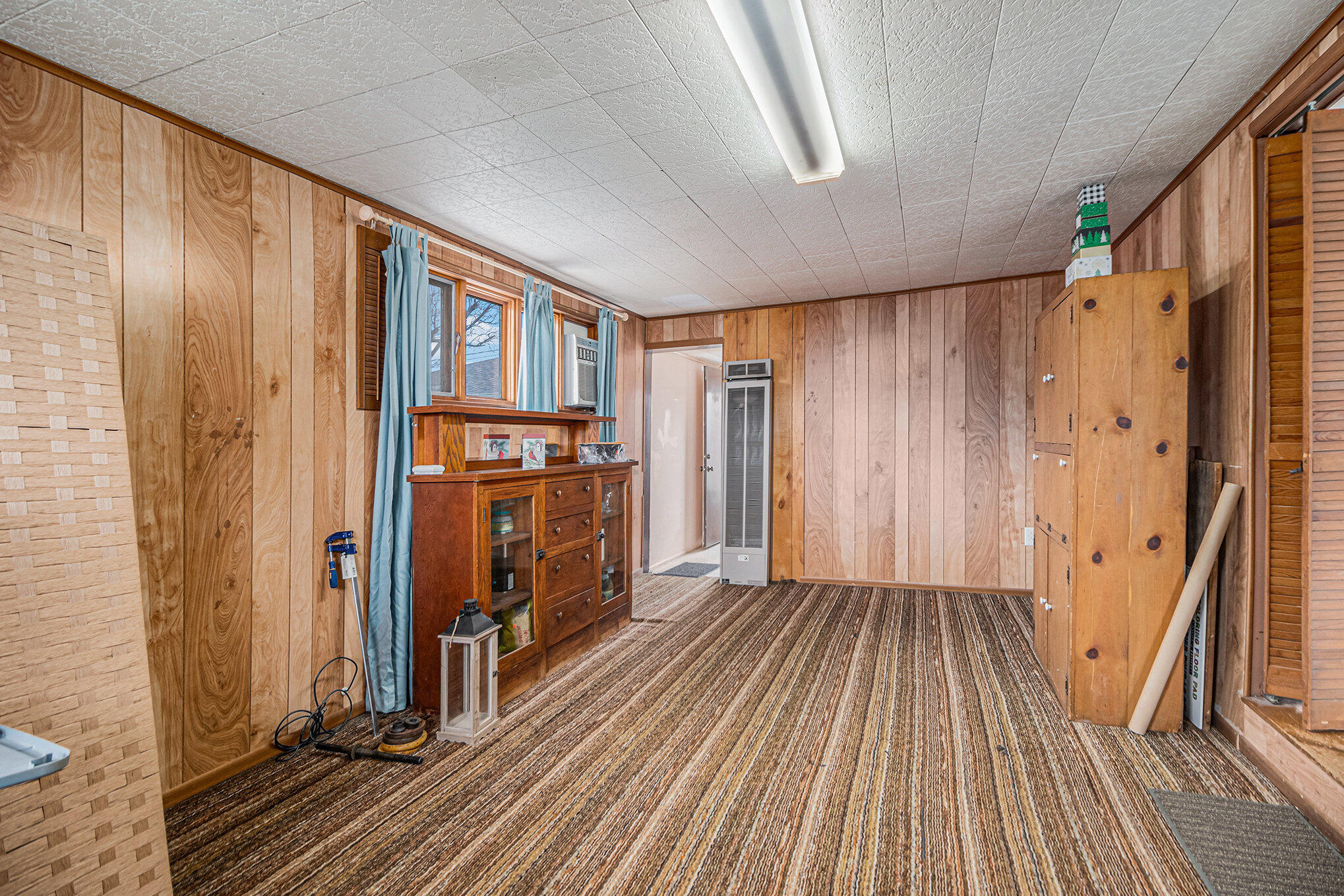 217 Crestview Lane Crown Point, IN 46307 - Photo 9 of 14 a view of a hallway with wooden floors and staircase