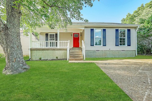 879 Heritage Circle Madison, TN 37115 - Photo 1 of 27 a front view of a house with a yard