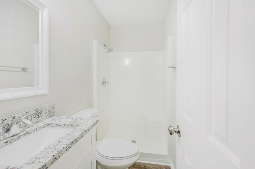 879 Heritage Circle Madison, TN 37115 - Photo 12 of 27 a bathroom with a granite countertop sink toilet and shower
