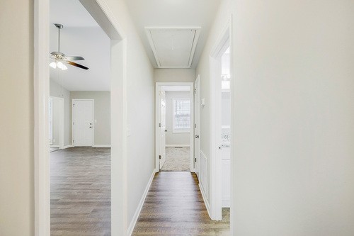 879 Heritage Circle Madison, TN 37115 - Photo 17 of 27 a view of a hallway with wooden floor and closet
