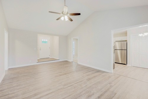 879 Heritage Circle Madison, TN 37115 - Photo 20 of 27 an empty room with wooden floor fan and windows