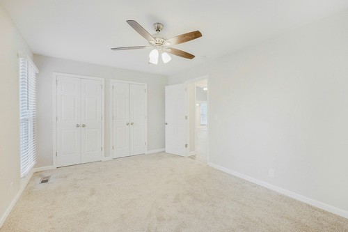 879 Heritage Circle Madison, TN 37115 - Photo 25 of 27 an empty room with a ceiling fan and a window