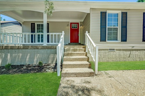 879 Heritage Circle Madison, TN 37115 - Photo 4 of 27 a front view of a house with a yard
