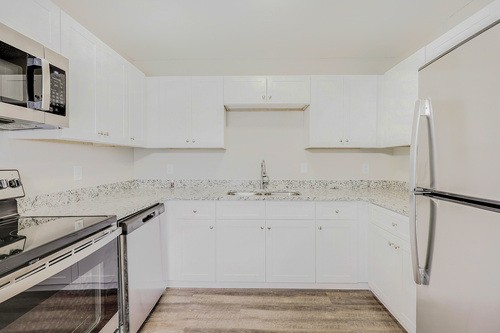 879 Heritage Circle Madison, TN 37115 - Photo 7 of 27 a kitchen with a sink and a refrigerator