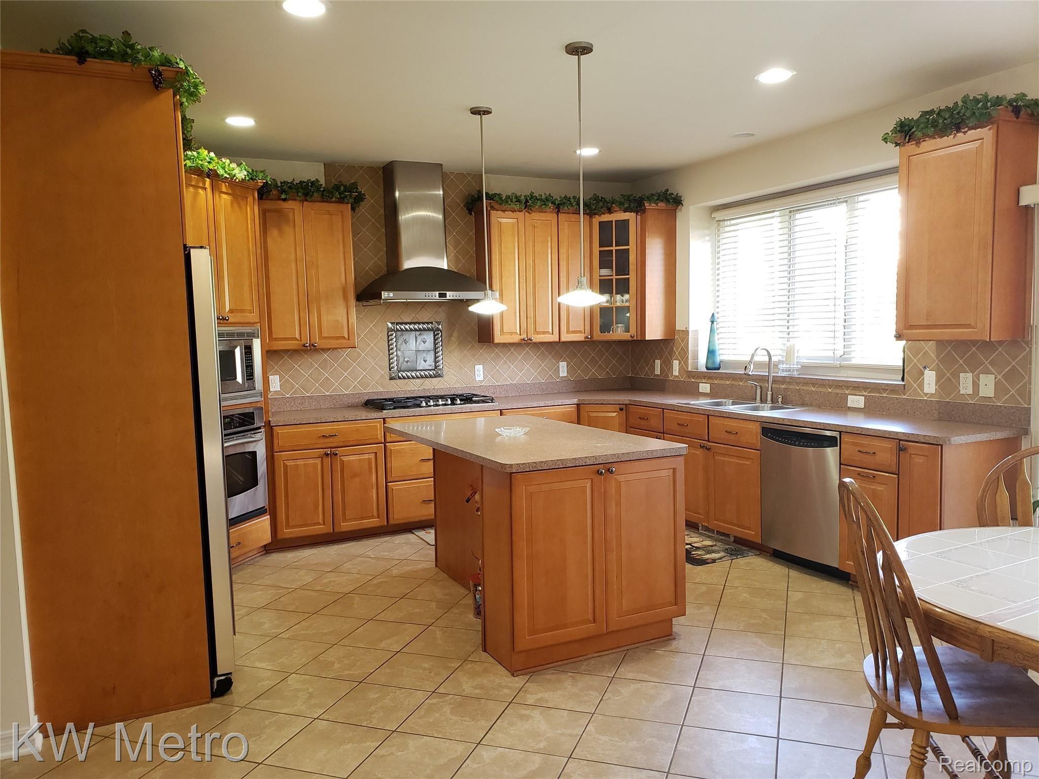 1227 Letica Drive Rochester, MI 48307 - Photo 25 of 58 Kitchen with Dishwasher & Disposal