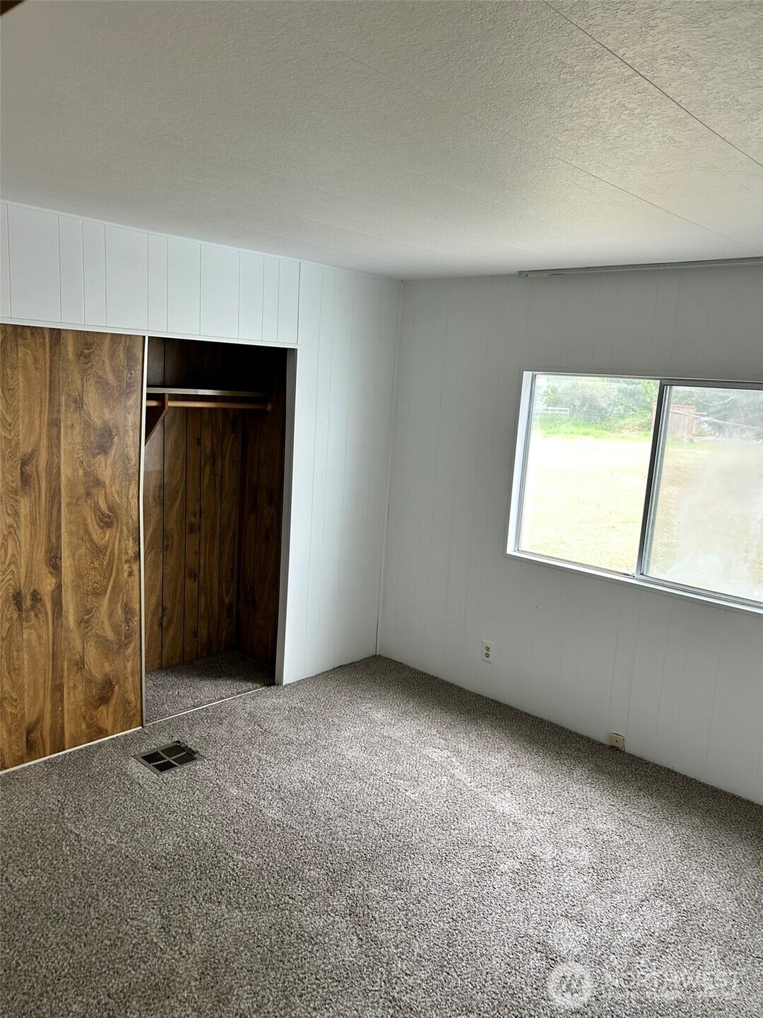 791 Elliot Court Sequim, WA 98382 - Photo 19 of 37 an empty room with windows