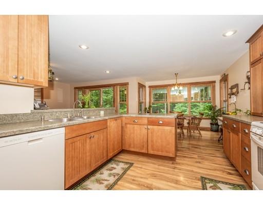 389 Turnpike Road Ashby, MA 01431 - Photo 14 of 30 a large kitchen with lots of counter top space and stainless steel appliances