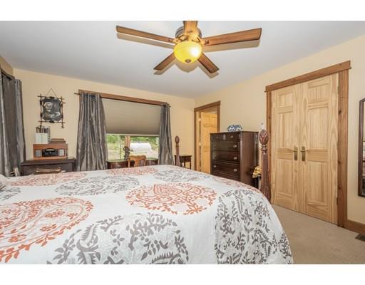 389 Turnpike Road Ashby, MA 01431 - Photo 16 of 30 a bedroom with a bed and a dresser