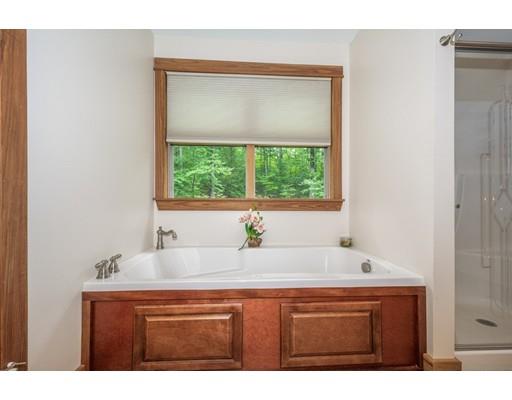 389 Turnpike Road Ashby, MA 01431 - Photo 18 of 30 a bathroom with a sink and a bathtub
