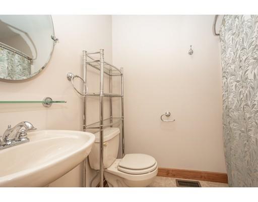 389 Turnpike Road Ashby, MA 01431 - Photo 22 of 30 a bathroom with a sink a toilet and shower