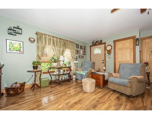 389 Turnpike Road Ashby, MA 01431 - Photo 23 of 30 a living room with furniture and a large window