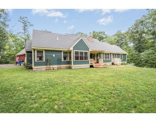389 Turnpike Road Ashby, MA 01431 - Photo 29 of 30 a front view of a house with a yard table and chairs