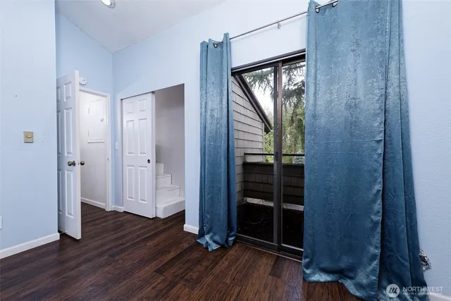 a view of front door with wooden floor