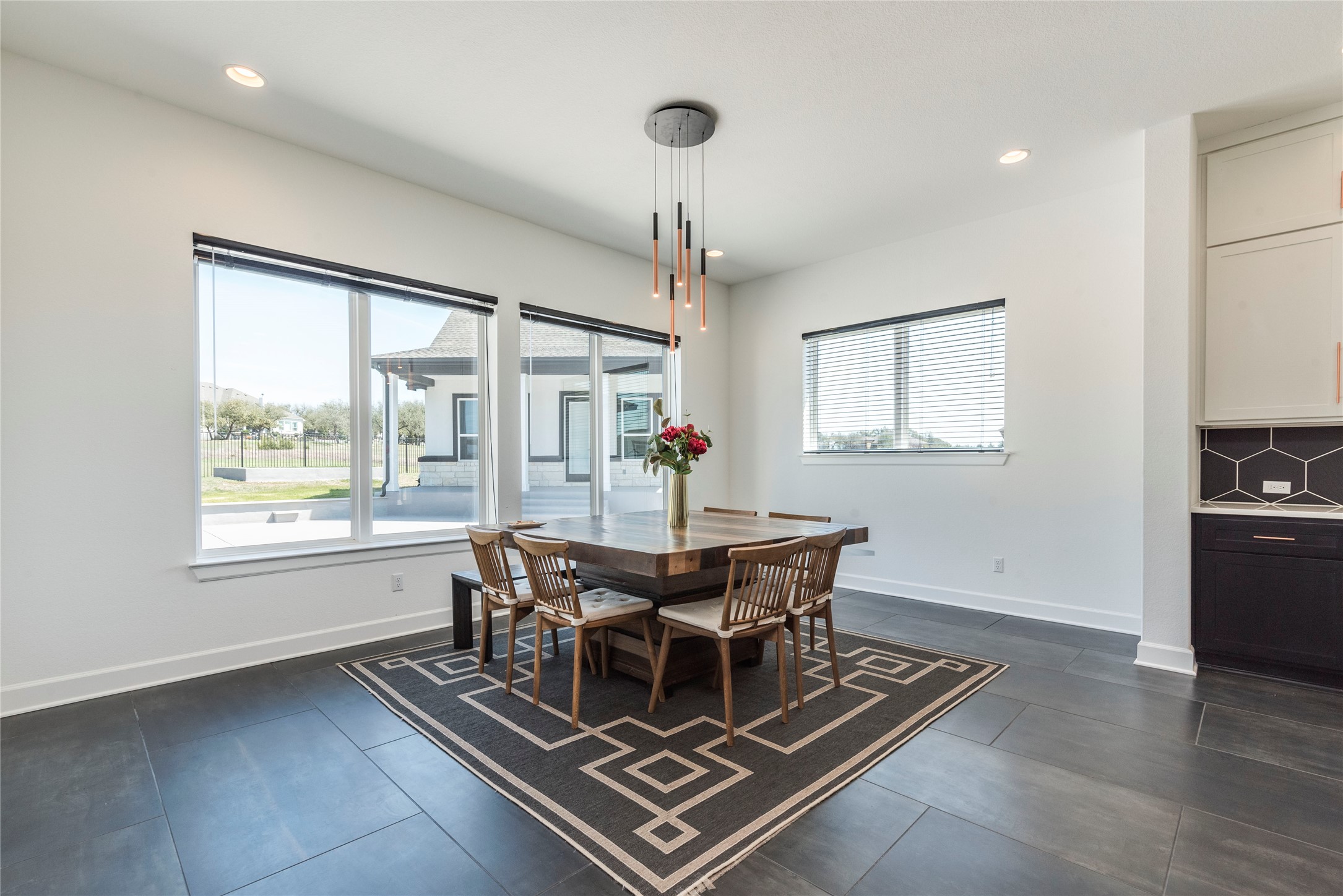 231 Call Drive Austin, TX 78737 - Photo 13 of 40 Large dining area with an abundance of natural light overlooks the pool