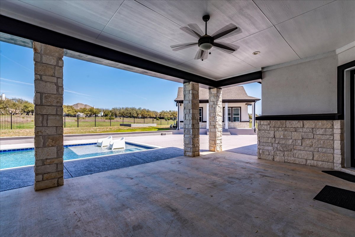 231 Call Drive Austin, TX 78737 - Photo 32 of 40 View of patio with a ceiling fan and an outdoor pool
