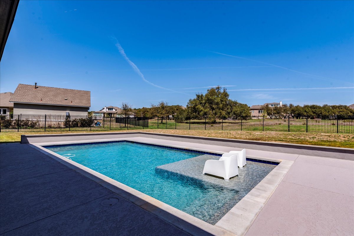 231 Call Drive Austin, TX 78737 - Photo 33 of 40 View of pool featuring patio surround and a fenced backyard