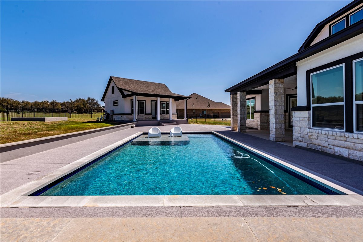 231 Call Drive Austin, TX 78737 - Photo 35 of 40 Swimming pool featuring an outbuilding, a patio, and an exterior structure