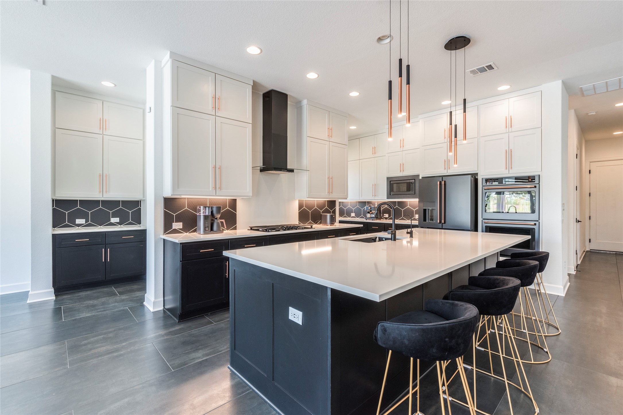 231 Call Drive Austin, TX 78737 - Photo 4 of 40 Gun metal black appliances with brass pulls and custom light fixtures