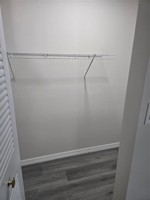 11854 Cove Place Boca Raton, FL 33428 - Photo 5 of 7 a view of small space with racks on the wall and a window