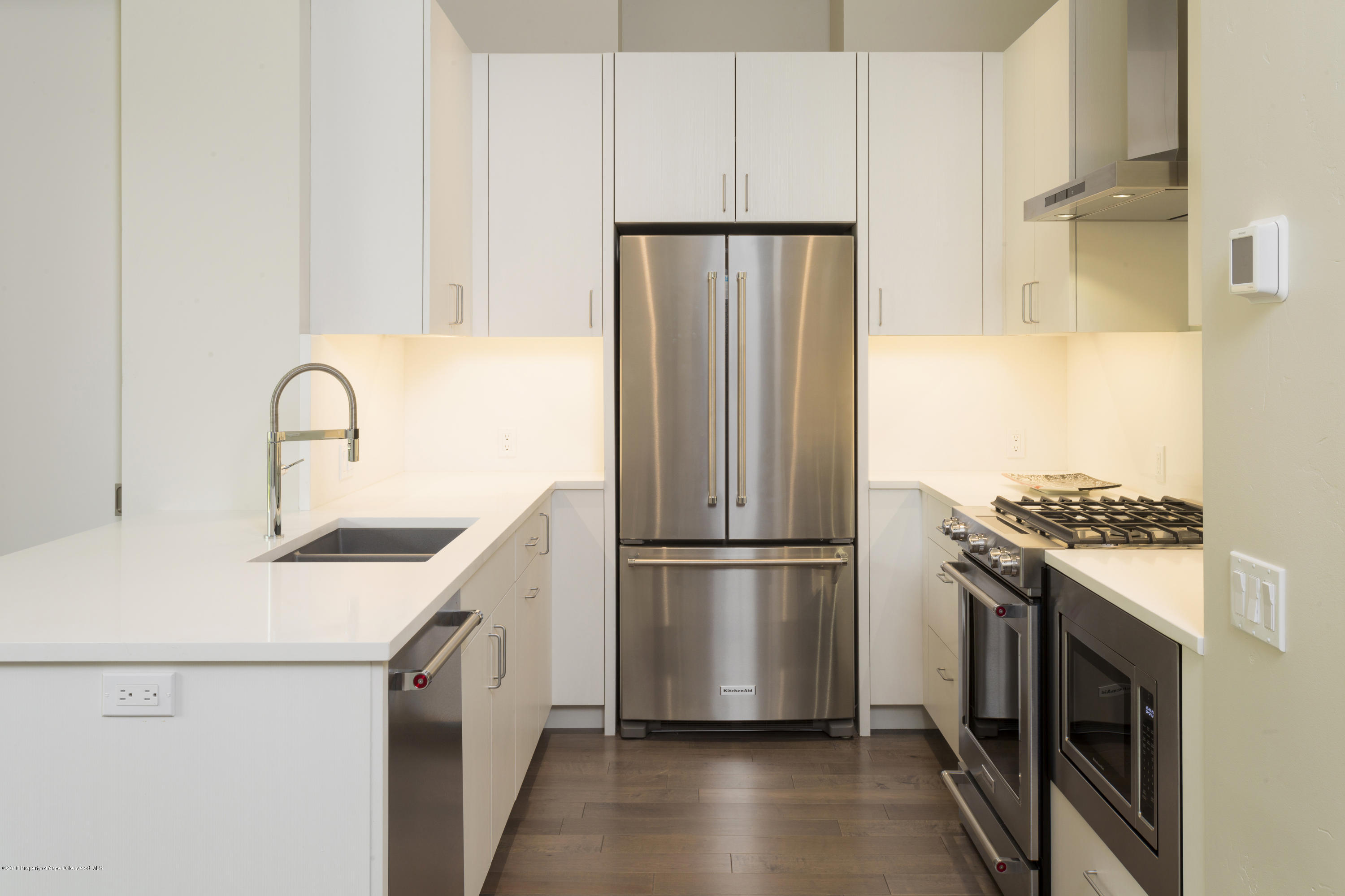 100 Evans Road, Unit 203 Basalt, CO 81621 - Photo 8 of 24 a kitchen with a refrigerator sink and stove