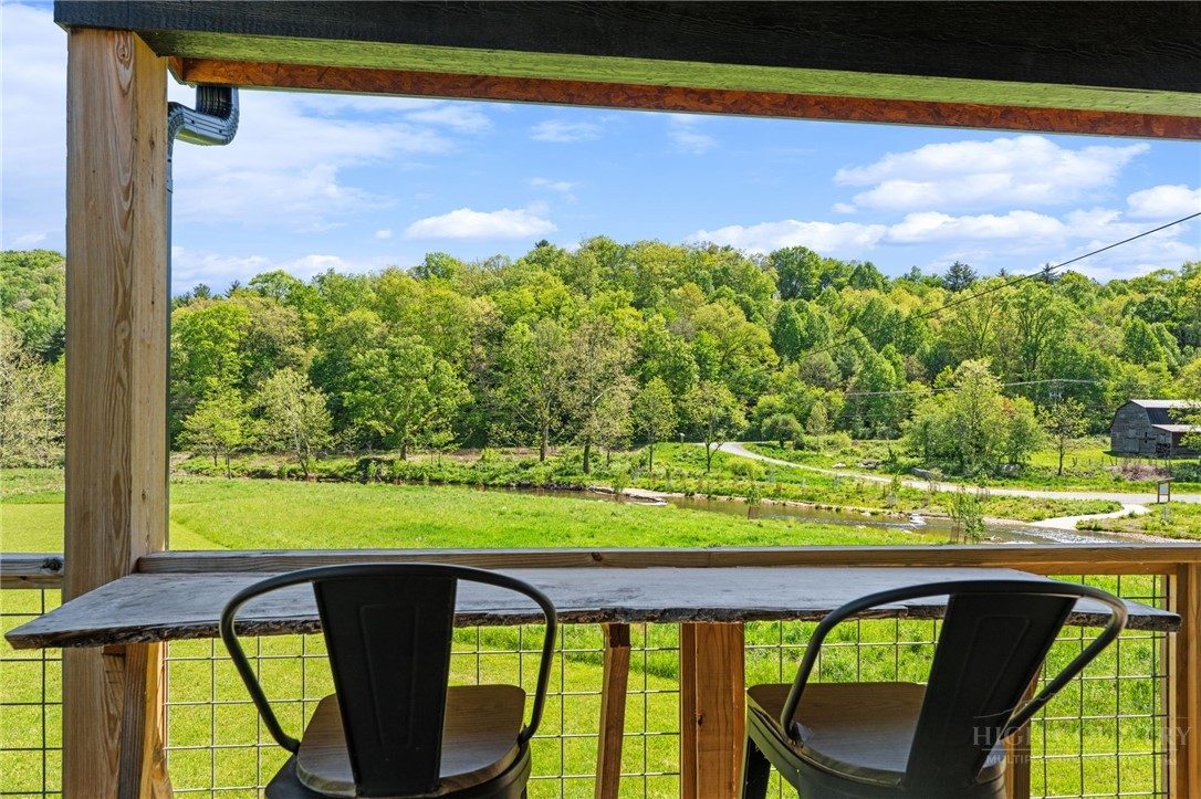 634-636 Watauga River Road Sugar Grove, NC 28679 - Photo 44 of 50 a view of two chairs and a table in the balcony