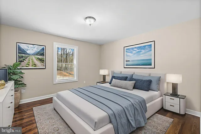 a bedroom with a large bed and a window