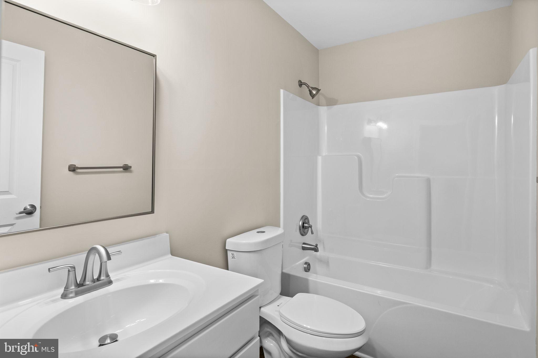 18078 Monrovia Road Orange, VA 22960 - Photo 16 of 49 a bathroom with a sink toilet and shower