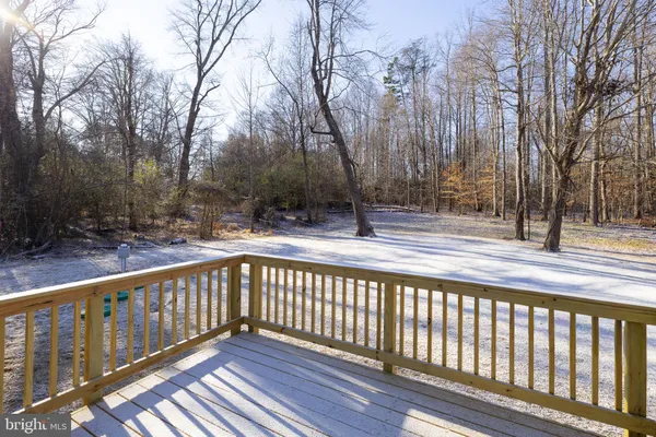 a view of a balcony with trees