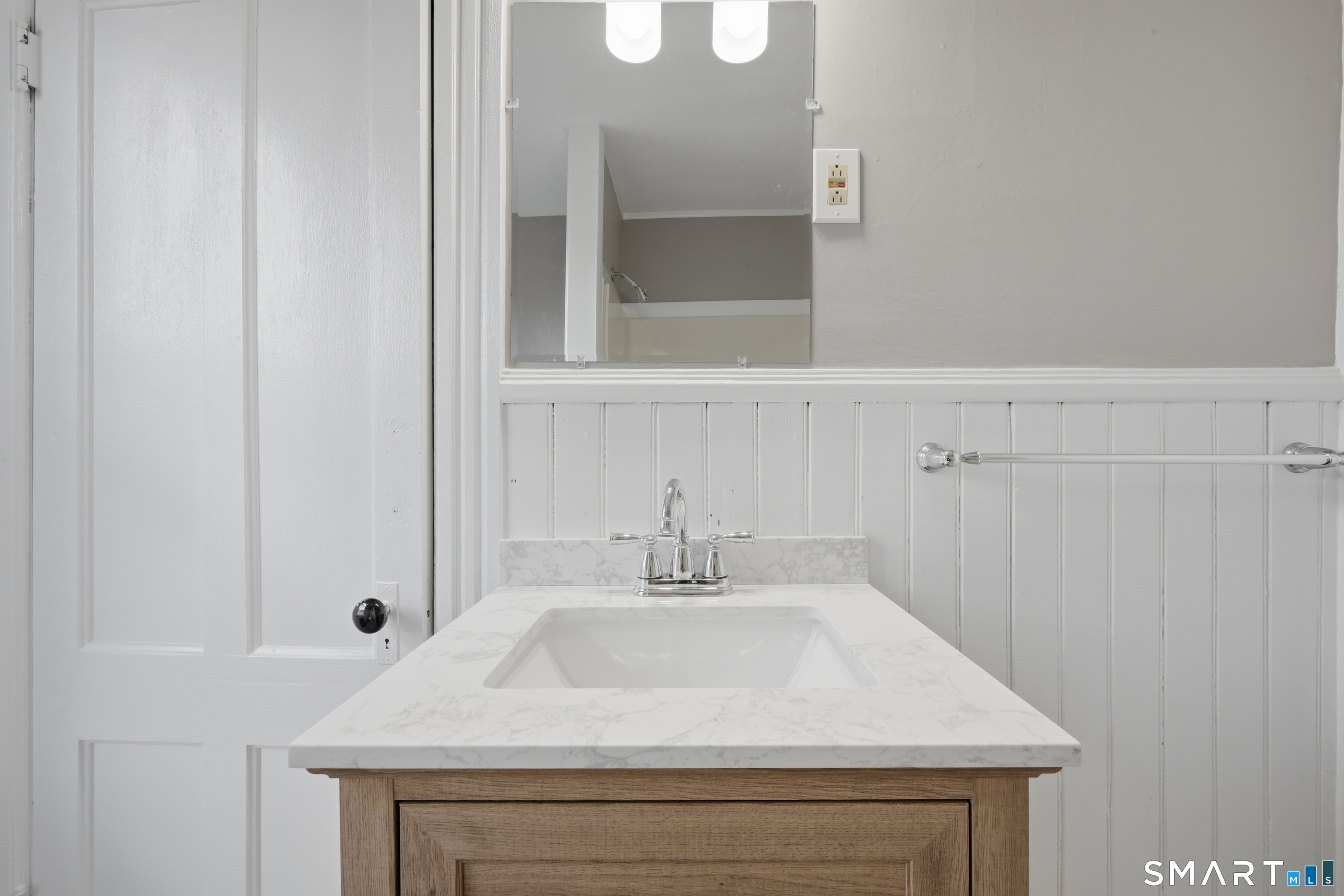 43 Dunham Street Norwich, CT 06360 - Photo 23 of 26 a sink with a mirror