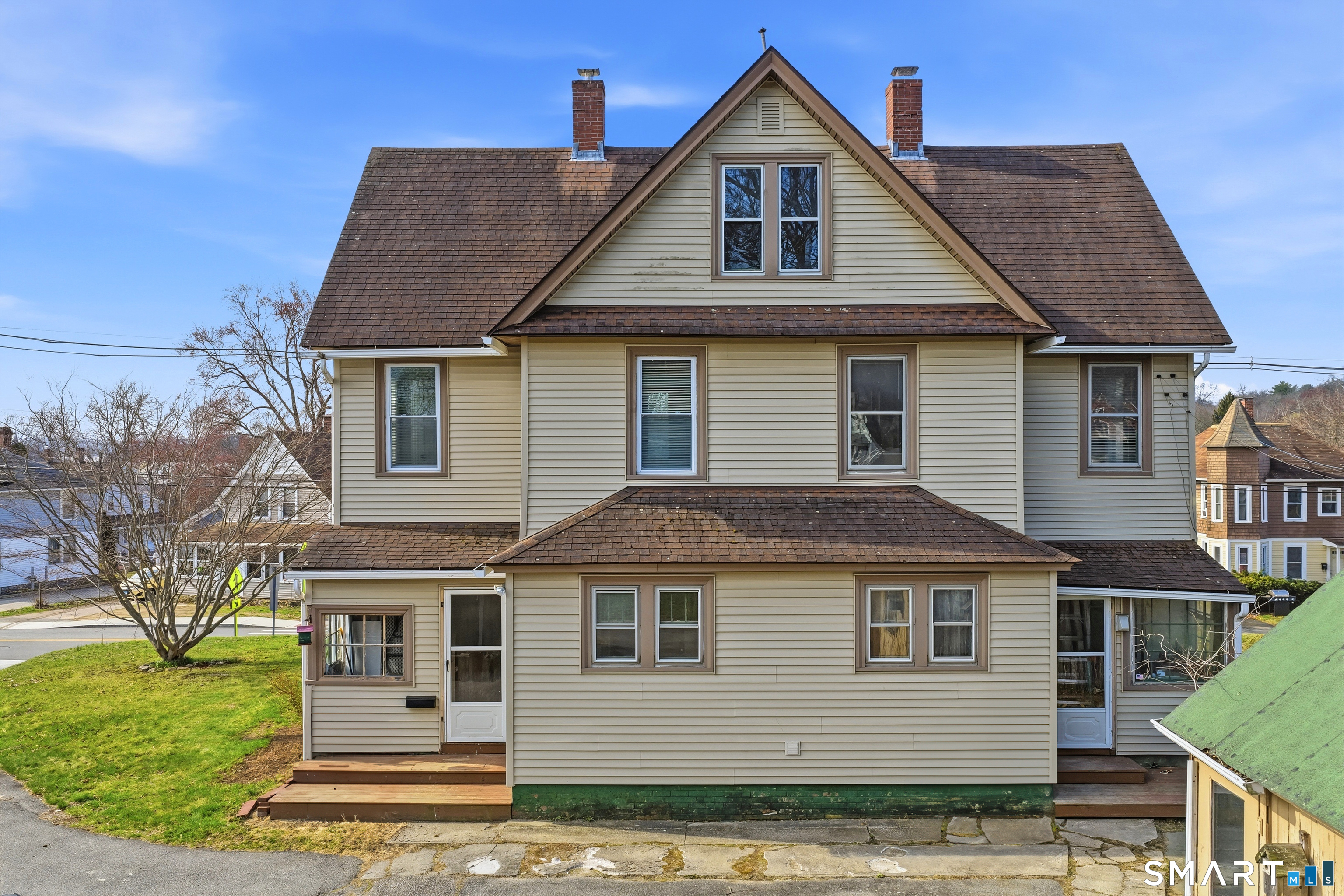43 Dunham Street Norwich, CT 06360 - Photo 4 of 26 a front view of a house with a yard