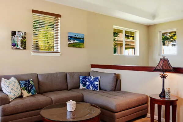 a en suite bathroom with a granite countertop sink and a mirror