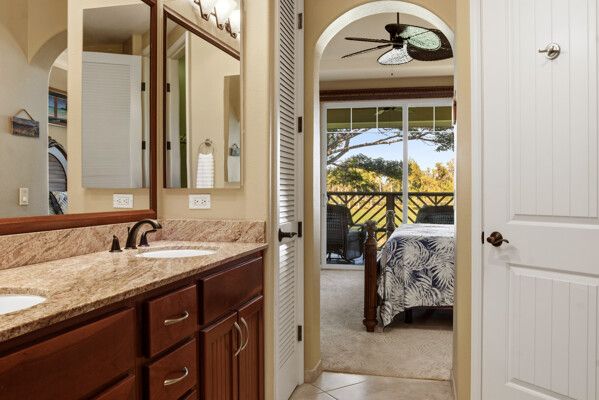 a view of a bedroom with furniture and windows