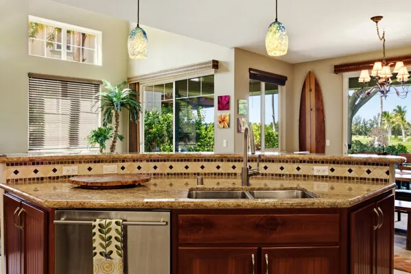 a view of a dining room and livingroom with furniture wooden floor a chandelier