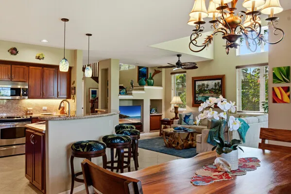 a view of a dining room with furniture and chandelier