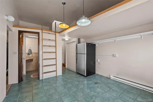 a view of a kitchen with a refrigerator and dishwasher